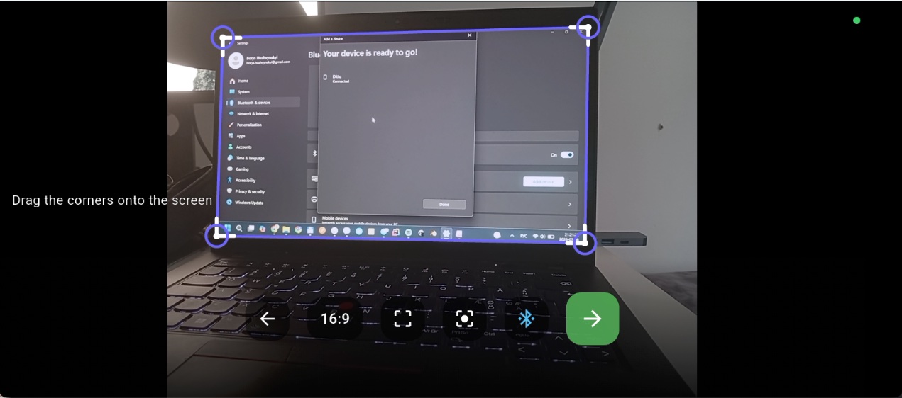 Dragging the four corner handles onto the monitor in the camera preview